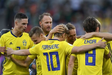 Sweden players celebrate after Ludwig Augustinsson scored their side's opening goal during the group F match between Mexico and Sweden, at the 2018 soccer World Cup in the Yekaterinburg Arena in Yekaterinburg , Russia, Wednesday, June 27, 2018. (AP Photo/Martin Meissner)