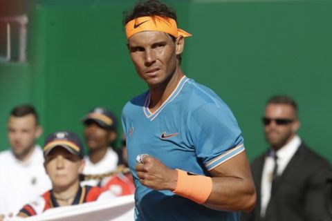 Spain's Rafael Nadal clenches his fist as he plays Argentina's Guido Pella during their quarterfinal match of the Monte Carlo Tennis Masters tournament in Monaco, Friday, April 19, 2019. (AP Photo/Claude Paris)