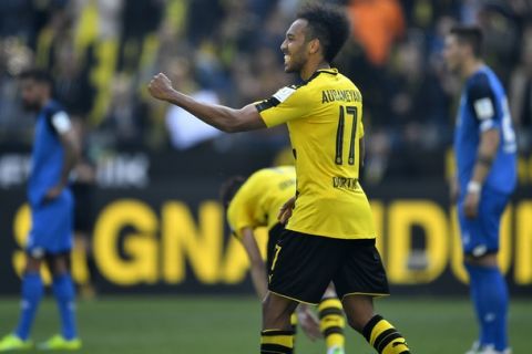 Dortmund's Pierre-Emerick Aubameyang celebrates after scoring during the German Bundesliga soccer match between Borussia Dortmund and TSG Hoffenheim in Dortmund, Germany, Saturday, May 6, 2017. (AP Photo/Martin Meissner)