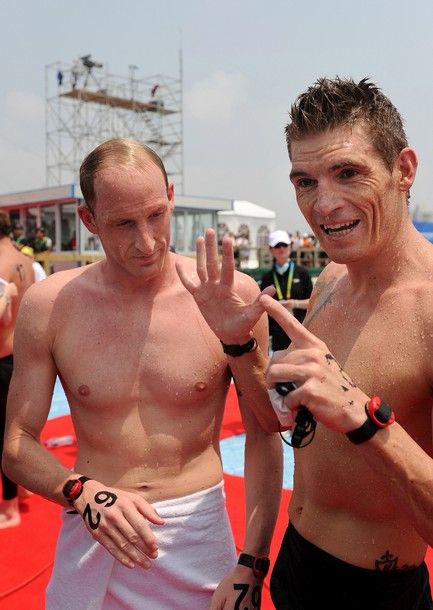 Gold medal winner Germany's Thomas Lurz (L) and silver medal winner Greece's Spyros Gianniotis (R) stand together after the men's 5km open water swimming event of the FINA World Championships at Jinshan beach in Shanghai on July 22, 2011. AFP PHOTO / PHILIPPE LOPEZ (Photo credit should read PHILIPPE LOPEZ/AFP/Getty Images)