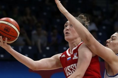 Russia's Anastasia Logunova, left, tries to score as Italy's Lorela Cubaj blocks her during the Women's 2019 Eurobasket European Basketball Championship match between Italy and Russia in Belgrade, Serbia, Tuesday, July 2, 2019. (AP Photo/Darko Vojinovic)