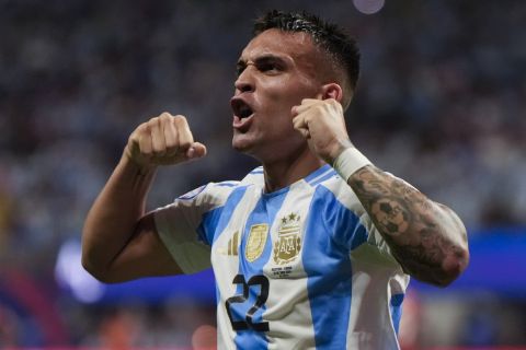 Argentina's Lautaro Martinez celebrates scoring his side's second goal against Canada during a Copa America Group A soccer match in Atlanta, Thursday, June 20, 2024. (AP Photo/Mike Stewart)