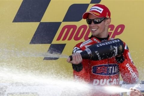 MotoGP Ducati rider Casey Stoner of Australia celebrates after winning the MotoGP Aragon Motorcycle Grand Prix at the Motorland racetrack in Alcaniz, Spain Sunday  Sept. 19, 2010 (AP Photo/Paul White)