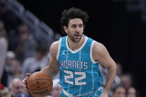 Charlotte Hornets' Vasilije Micic dribbles during the first half of an NBA basketball game against the Indiana Pacers, Sunday, Dec. 8, 2024, in Indianapolis. (AP Photo/Darron Cummings)