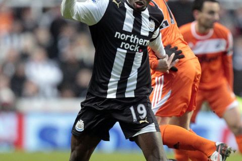 Newcastle United's Senegalese striker Demba Ba (front) vies with Swansea City's Mark Gower during their English FA Premier League football match at St James' Park, in Newcastle upon Tyne on December 17, 2011. AFP PHOTO/GRAHAM STUART

RESTRICTED TO EDITORIAL USE. No use with unauthorized audio, video, data, fixture lists, club/league logos or "live" services. Online in-match use limited to 45 images, no video emulation. No use in betting, games or single club/league/player publications. (Photo credit should read GRAHAM STUART/AFP/Getty Images)