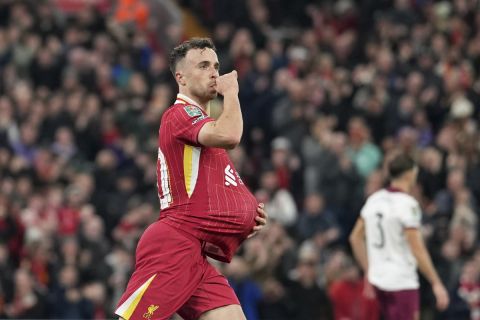 Liverpool's Diogo Jota celebrates after scoring his side's first goal during the English League Cup soccer match between Liverpool and West Ham United at Anfield Stadium, Liverpool, England, Wednesday, Sept. 25, 2024. (AP Photo/Jon Super)