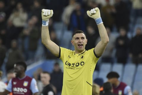 Aston Villa's goalkeeper Emiliano Martinez celebrates towards the fans after the end of the English Premier League soccer match between Aston Villa and Fulham at Villa Park in Birmingham, England, Tuesday, April 25, 2023. Villa won the match 1-0. (AP Photo/Rui Vieira)