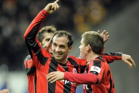 Frankfurt's Theofanis Gekas of Greece celebrates his second goal during the German soccer cup match between Eintracht Frankfurt and Hamburger SV in Frankfurt, Germany, Wednesday, Oct . 27, 2010. (AP Photo/Martin Meissner) ** NO MOBILE USE UNTIL 2 HOURS AFTER THE MATCH, WEBSITE USERS ARE OBLIGED TO COMPLY WITH DFB-RESTRICTIONS, SEE INSTRUCTIONS FOR DETAILS **