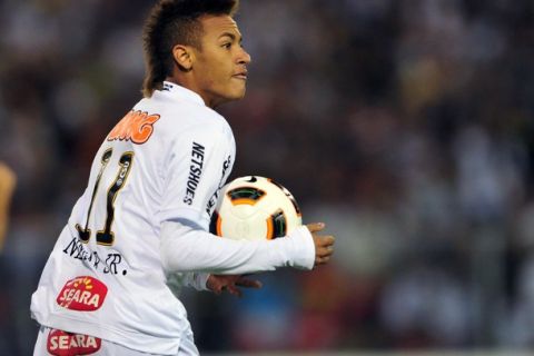 Neymar, of Brazil's Santos, celebrates after scoring against Chile's Colo Colo, during their Copa Libertadores football match in Santiago, on March 16, 2011.  AFP PHOTO/Martin BERNETTI (Photo credit should read MARTIN BERNETTI/AFP/Getty Images)