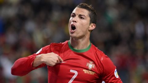 Portugal's forward Cristiano Ronaldo celebrates after scoring the second goal for Portugal during the FIFA 2014 World Cup playoff football match Sweden vs Portugal at the Friends Arena in Solna near Stockholm on November 19, 2013 . AFP PHOTO/ JONATHAN NACKSTRAND        (Photo credit should read JONATHAN NACKSTRAND/AFP/Getty Images)