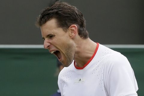 Austria's Dominic Thiem reacts as he plays United States' Sam Querrey in a Men's singles match during day two of the Wimbledon Tennis Championships in London, Tuesday, July 2, 2019. (AP Photo/Tim Ireland)