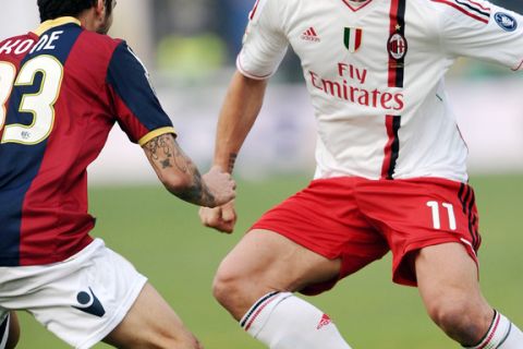 Bologna's Panagiotis Giorgios Kone (L) vies AC Milan's Zlatan Ibrahimovic during an Italian Serie A football match at Dall'Ara stadium in Bologna on  December 11, 2011.                  AFP  PHOTO / VINCENZO PINTO (Photo credit should read VINCENZO PINTO/AFP/Getty Images)