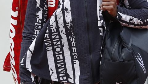 Serena Williams of the U.S. wears a jacket with French text reading "Champion", "Queen", "Godess", and "Mother" after warming up prior to her first round match of the French Open tennis tournament against Vitalia Diatchenko of Russia at the Roland Garros stadium in Paris, Monday, May 27, 2019. (AP Photo/Pavel Golovkin)