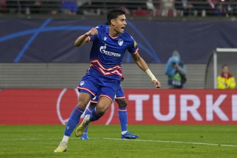 Red Star's Marko Stamenic celebrates after scoring his side's opening goal during the group G Champions League soccer match between RB Leipzig and Red Star Belgrade at the Red Bull arena stadium in Leipzig, Germany, Wednesday, Oct. 25, 2023. (AP Photo/Matthias Schrader)