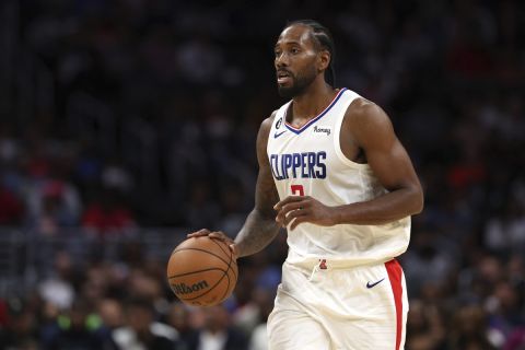 LA Clippers forward Kawhi Leonard dribbles the ball during the first half of an NBA preseason game against the Minnesota Timberwolves, Sunday, Oct. 9, 2022, in Los Angeles. Timberwolves won 119-117. (AP Photo/Raul Romero Jr.)