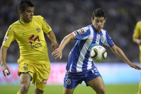 FC Porto's Colombian forward James Rodriguez (R) vies with Pacos Ferreira's Paraguayan defender Javier Cohene (L) during their Portuguese super league football match at the Dragao Stadium in Porto on May 8, 2011. AFP PHOTO / MIGUEL RIOPA (Photo credit should read MIGUEL RIOPA/AFP/Getty Images)