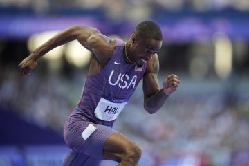 Quincy Hall, of the United States, competes in a men's 400 meters semifinal at the 2024 Summer Olympics, Tuesday, Aug. 6, 2024, in Saint-Denis, France. (AP Photo/Ashley Landis)