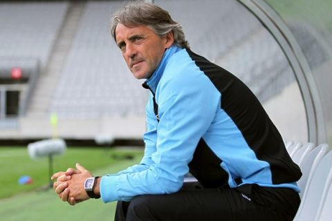 INNSBRUCK, AUSTRIA - JULY 13:  Roberto Mancini, head coach of Manchester looks on ahead of a preseason friendly match between Manchester City and Al Hilal fight for the ball at Tivoli Neu on July 13, 2012 in Innsbruck, Austria.  (Photo by Johannes Simon/Getty Images)