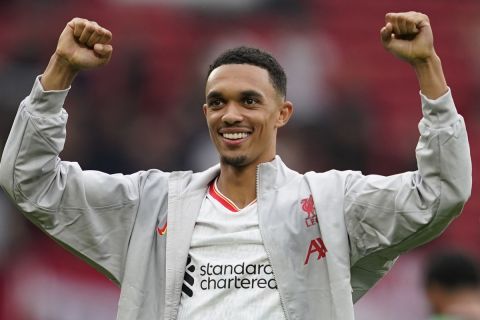 Liverpool's Trent Alexander-Arnold celebrates their victory at the English Premier League soccer match between Manchester United and Liverpool at Old Trafford, Sunday, Sept. 1, 2024, in Manchester, England. (AP Photo/Dave Thompson)