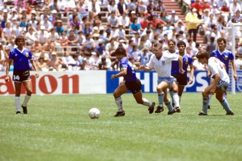 England's Peter Reid (third l) gives chase as Argentina's Diego Maradona (second l) goes forward on another run