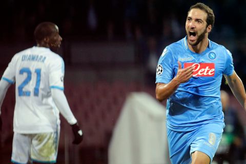 Napoli's Argentinian forward Gonzalo Higuain celebrates after scoring a goal during an UEFA Champions League group F football match between SSC Napoli and Olympique de Marseille at the San Paolo Stadium in Naples on November 6, 2013..    AFP PHOTO/CARLO HERMANN        (Photo credit should read CARLO HERMANN/AFP/Getty Images)