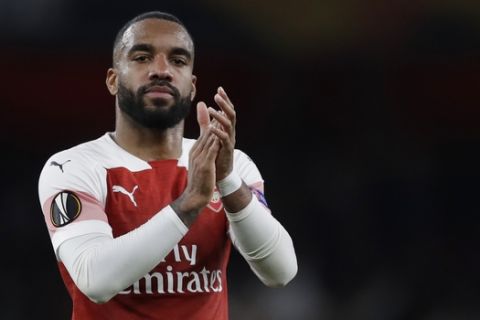 Arsenal's Alexandre Lacazette celebrates at the end of the Europa League semifinal first leg soccer match between Arsenal and Valencia at the Emirates stadium in London, Thursday, May 2, 2019. Arsenal won 3-1. (AP Photo/Kirsty Wigglesworth)