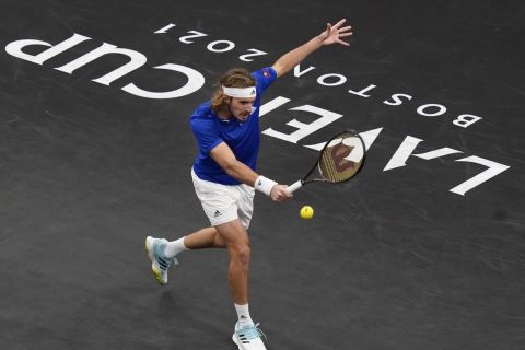 Team Europe's Stefanos Tsitsipas, of Greece, returns the ball to Team World's Nick Kyrgios, of Australia, during Laver Cup tennis, Saturday, Sept. 25, 2021, in Boston. (AP Photo/Elise Amendola)