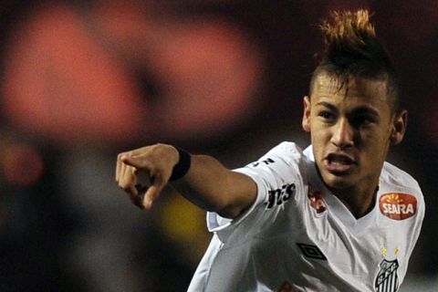 Neymar of Brazil's Santos celebrates after scoring against Uruguay's Penarol, during their 2011 Copa Libertadores second leg final football match, at Pacaembu stadium, in Sao Paulo, Brazil, on June 22, 2011. AFP PHOTO /VANDERLEI ALMEIDA (Photo credit should read VANDERLEI ALMEIDA/AFP/Getty Images)