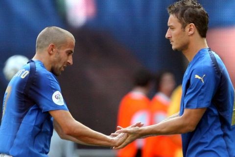 Italy's Francesco Totti, right, replaces teammate Alessandro Del Piero during the Australia vs Italy Round of 16 World Cup soccer match at Fritz Walter Stadium in Kaiserslautern, Germany, Monday, June 26, 2006.  (AP Photo/Andrew Medichini)  **  MOBILE/PDA USAGE OUT  **