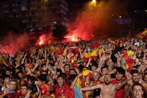 Spain supporters celebrate their country's victory over England in the Euro 2024 soccer tournament final from Madrid, Spain, July 14, 2024. (AP Photo/Andrea Comas)