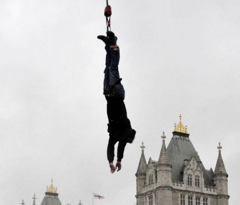 James Field bungee jumps in front of London's Tower Bridge during his successful attempt to break the World Record for the number of jumps in one hour. PRESS ASSOCIATION Photo. Picture date: Sunday September 26, 2010. He completed 42 jumps, compared to the old record of 19. Photo credit should read: Tim Ireland/PA Wire