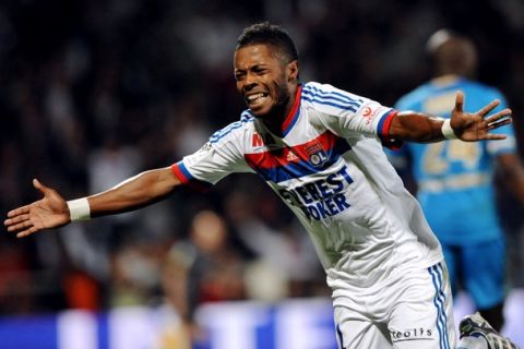 Lyon's Brazilian midfielder Michel Bastos celebrates after scoring a goal during the French L1 football match Lyon vs Marseille on September 18, 2011 at the Gerland stadium in Lyon. AFP PHOTO PHILIPPE MERLE (Photo credit should read PHILIPPE MERLE/AFP/Getty Images)