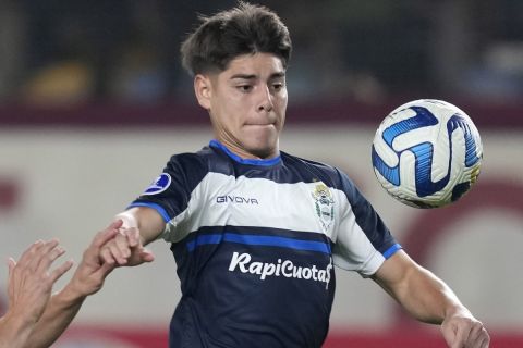 Benjamín Domínguez of Argentina's Gimnasia y Esgrima La Plata, right, and Aldo Corzo of Peru's Universitario battle for the ball during a Copa Sudamericana Group G soccer match at Monumental stadium in Lima, Peru, Thursday, June 28, 2023. (AP Photo/Martin Mejia)