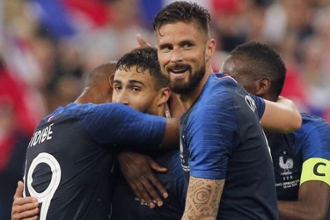 France's Nabil Fekir, center right, is congratulated by his teammates after scoring his side's 2nd goal during a friendly soccer match between France and Ireland at the Stade de France stadium, in Saint Denis, north of Paris, France, Monday, May, 28, 2018. (AP Photo/Thibault Camus)