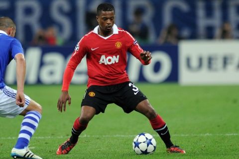 Manchester's French defender Patrice Evra plays the ball during the Champions League semi-final, first-leg match of Schalke 04 against Manchester United on April 26, 2011 in Gelsenkirchen, western Germany. Manchester United won the match 0-2. AFP PHOTO / PATRIK STOLLARZ (Photo credit should read PATRIK STOLLARZ/AFP/Getty Images)