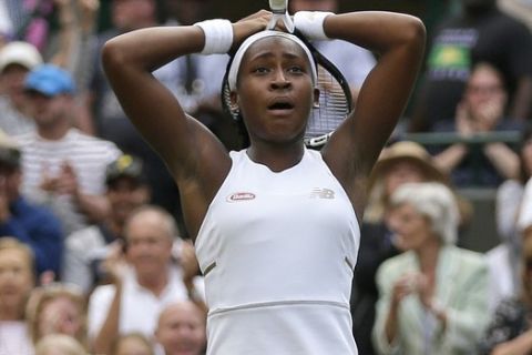 United States' Cori "Coco" Gauff reacts after beating United States's Venus Williams in a Women's singles match during day one of the Wimbledon Tennis Championships in London, Monday, July 1, 2019. (AP Photo/Tim Ireland)