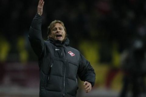 CORRECTS  NAME OF COACH AND TEAM  -- Spartak Moscow's team coach Valeri Karpin, reacts  during their Europa league soccer match against Ajax's team in Moscow, Russia, Thursday, March 17, 2011. (AP Photo/Alexander Zemlianichenko)