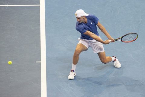 Aristotelis Thanos of Greece plays a shot against Hubert Hurkacz of Poland during their match at the ATP Cup tennis tournament in Sydney, Saturday, Jan. 1, 2022. (AP Photo/Steve Christo)