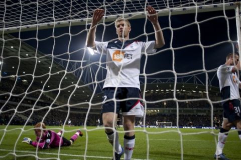 Bolton's Tim Ream, centre, David Wheater, right, and Adam Bogdan react after a Tottenham goal during their English Premier League soccer match at The Reebok Stadium, Bolton, England, Wednesday, May 2, 2012. (AP Photo/Jon Super)