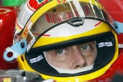 Ferrari Formula One driver Luca Badoer of Italy looks on in the pits while seating in his car during the second free practice ahead the Belgium Formula One Grand Prix in Spa-Francorchamps circuit , Belgium, Friday, Aug. 28 2009 . The Formula one race will be held on Sunday. (AP Photo/Michel Spingler)