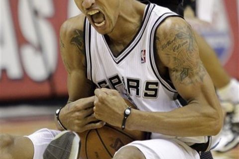 San Antonio Spurs' George Hill reacts after he won control of a loose ball during the fourth quarter of an NBA basketball game against the Minnesota Timberwolves, Friday, Dec. 3, 2010, in San Antonio. San Antonio won 107-101.(AP Photo/Eric Gay)