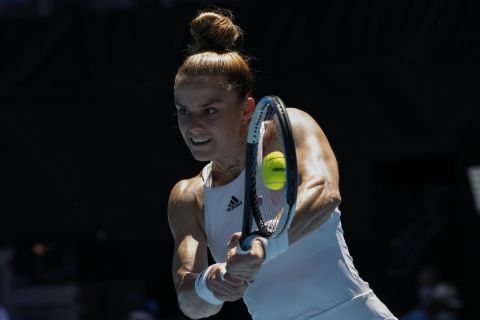 Maria Sakkari of Greece plays a backhand return to Veronika Kudermetova of Russia during their third round match at the Australian Open tennis championships in Melbourne, Australia, Friday, Jan. 21, 2022. (AP Photo/Hamish Blair)