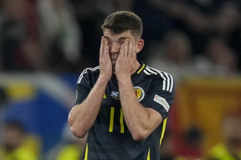 Scotland's Ryan Christie is dejected at the end of a Group A match between Scotland and Hungary at the Euro 2024 soccer tournament in Stuttgart, Germany, Sunday, June 23, 2024. (AP Photo/Matthias Schrader)