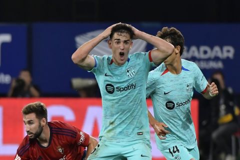 Barcelona's Gavi reacts during Spanish La Liga soccer match between Osasuna and Barcelona at El Sadar stadium in Pamplona, Spain, Sunday, Sept. 3, 2023. (AP Photo/Alvaro Barrientos)