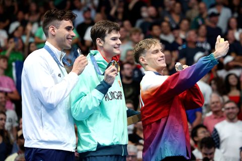 NANTERRE, FRANCE - AUGUST 01: Gold Medalist Hubert Kos of Team Hungary (C), Silver Medalist Apostolos Christou of Team Greece (L) and Bronze Medalist Roman Mityukov of Team Switzerland (R) pose for a selfie on the podium during the Swimming medal ceremony after the Men's 200m Backstroke Final on day six of the Olympic Games Paris 2024 at Paris La Defense Arena on August 01, 2024 in Nanterre, France. (Photo by Adam Pretty/Getty Images)