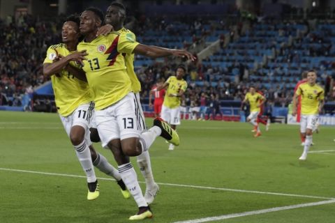 Colombia's Yerry Mina celebrates after scoring his first side's goal during the round of 16 match between Colombia and England at the 2018 soccer World Cup in the Spartak Stadium, in Moscow, Russia, Tuesday, July 3, 2018. (AP Photo/Ricardo Mazalan)