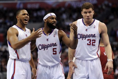 LOS ANGELES, CA - JANUARY 12:  Baron Davis #5, Eric Gordon #10 and Blake Griffin #32 of the Los Angeles Clippers react after a foul during the game against the Miami Heat at the Staples Center on January 12, 2011 in Los Angeles, California.  NOTE TO USER: User expressly acknowledges and agrees that, by downloading and or using this photograph, User is consenting to the terms and conditions of the Getty Images License Agreement.  (Photo by Harry How/Getty Images)