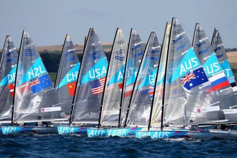 WEYMOUTH, ENGLAND - JULY 28:  Brendan Casey of Australia in action during a Finn Class practice race at the Weymouth & Portland Venue during the London 2012 Olympic Games on July 28, 2012 in Weymouth, England.  (Photo by Clive Mason/Getty Images)