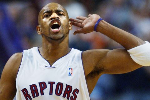 Toronto Raptors forward Vince Carter gestures for the fans to make some noise in the final minutes of NBA play against the Sacramento Kings in Toronto on Sunday, Jan. 26, 2003.  Carter's game-high 22 points helped the Raptors' to defeat the Kings 101-97.  Carter returned to play on his 26th birthday, having been sidelined with a knee injury since early December.   (AP Photo/J.P. Moczulski)