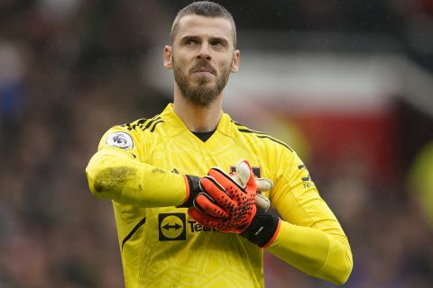 Manchester United's goalkeeper David de Gea stands on the pitch during the English Premier League soccer match between Manchester United and Aston Villa at the Old Trafford stadium in Manchester, England, Sunday, April 30, 2023. (AP Photo/Dave Thompson)